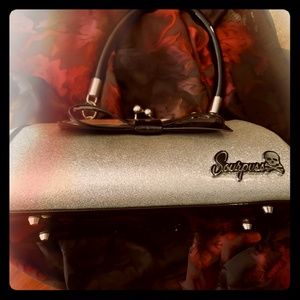 Sourpuss silver floozy purse.  Limited edition